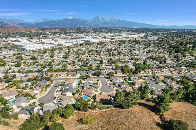 birds eye view of property with a mountain view