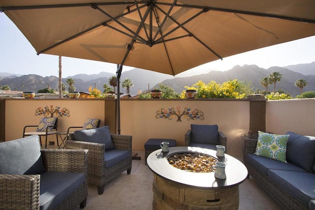 view of patio / terrace with a mountain view and an outdoor living space