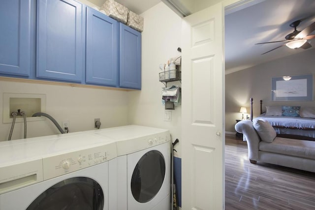 laundry room with ceiling fan, cabinets, dark hardwood / wood-style floors, and washing machine and dryer