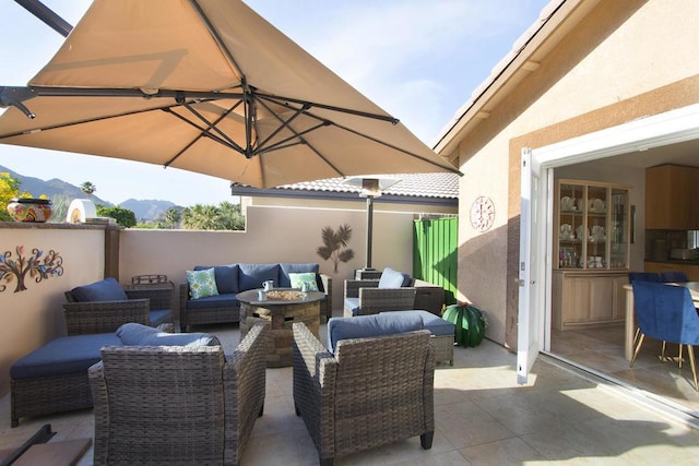 view of patio with a mountain view and an outdoor living space