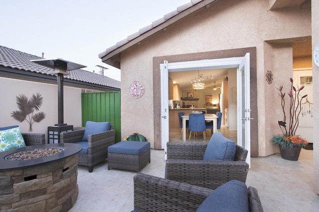 view of patio / terrace featuring an outdoor living space with a fire pit