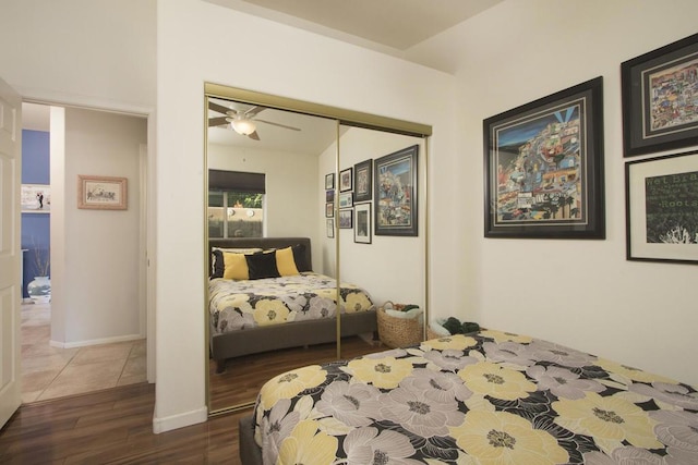 bedroom featuring ceiling fan and dark hardwood / wood-style floors