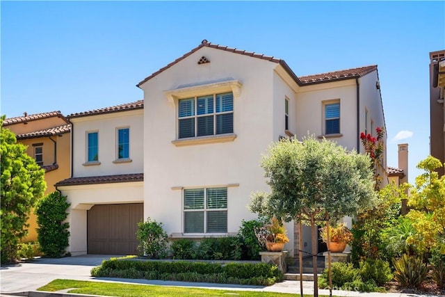 mediterranean / spanish-style house featuring a garage