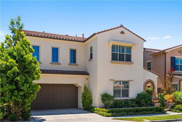 mediterranean / spanish-style house featuring a garage