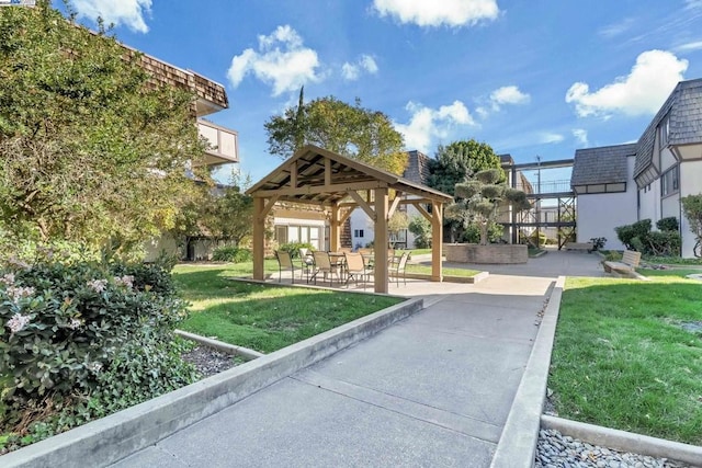 view of community with a gazebo and a yard