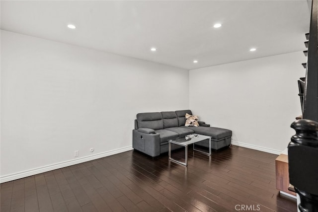 living room featuring dark wood-type flooring