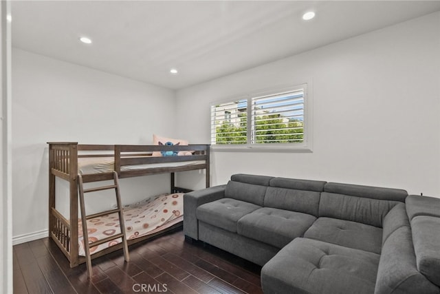 bedroom with dark wood-type flooring