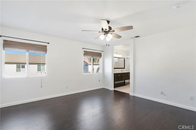 unfurnished room featuring ceiling fan and dark hardwood / wood-style flooring