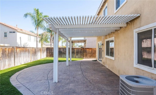 view of patio / terrace with a pergola and central AC