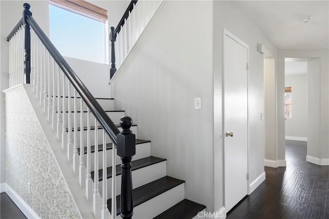 stairway featuring hardwood / wood-style floors