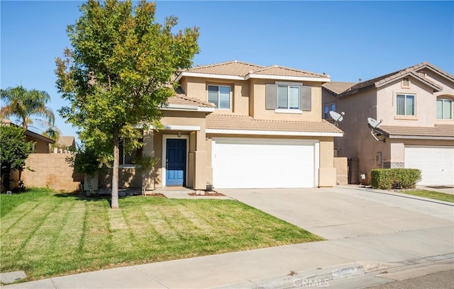 mediterranean / spanish-style home with a garage and a front yard