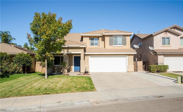 view of front of property with a front yard and a garage