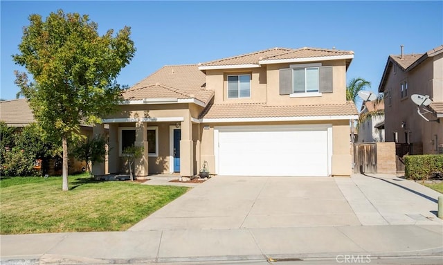 view of front of house featuring a front yard and a garage