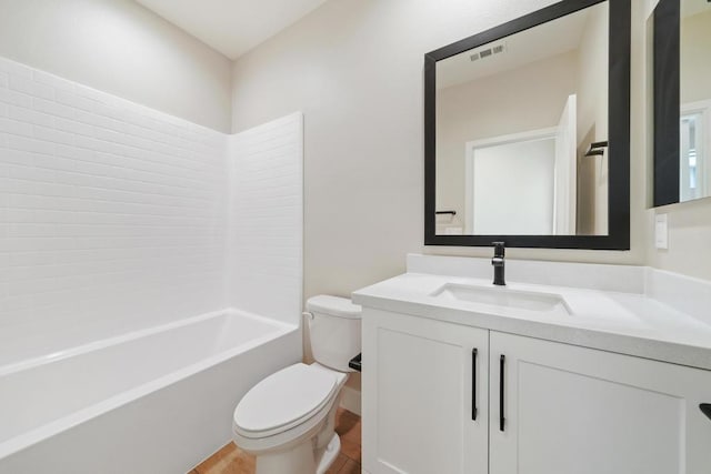 full bathroom with vanity, tub / shower combination, and toilet