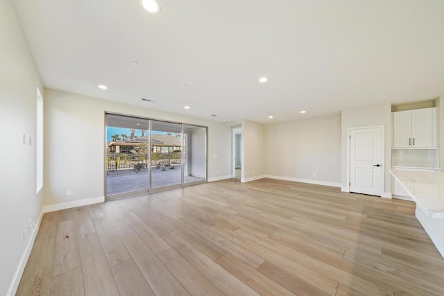 unfurnished living room featuring light hardwood / wood-style flooring