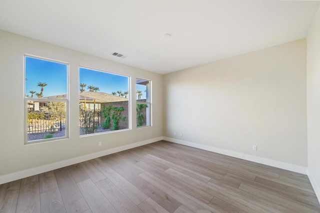 spare room featuring light hardwood / wood-style flooring