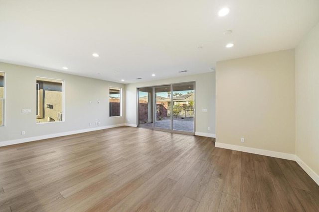 unfurnished living room with light hardwood / wood-style flooring