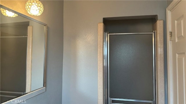 bathroom featuring an enclosed shower