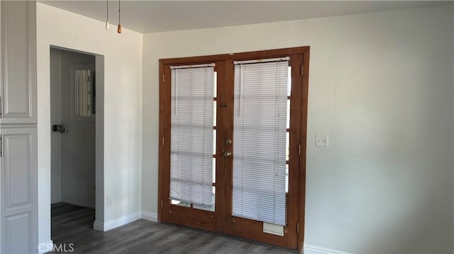 entryway featuring french doors and dark wood-type flooring