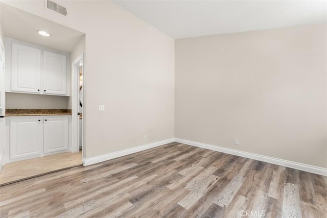 empty room featuring light hardwood / wood-style floors