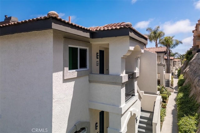 view of property exterior featuring a balcony