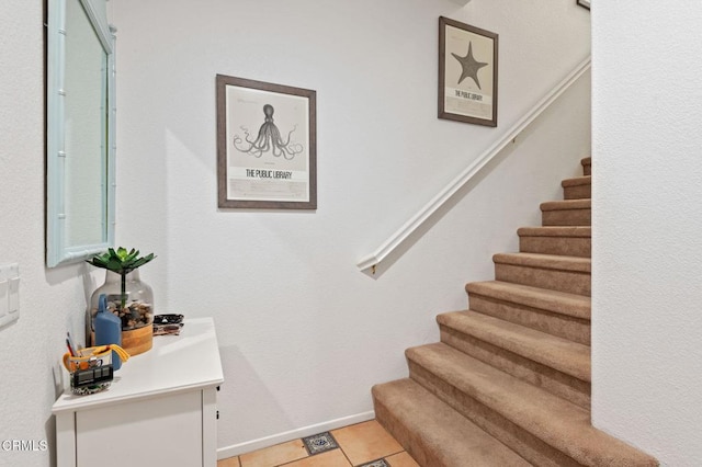 staircase with tile patterned floors