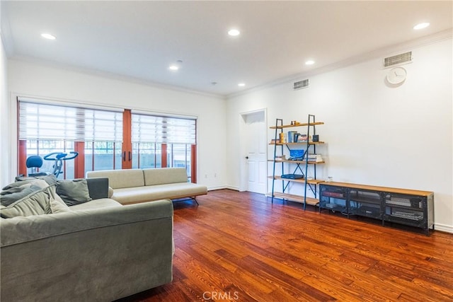 living room featuring crown molding and dark hardwood / wood-style flooring