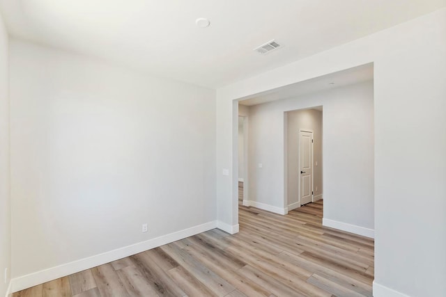 unfurnished room with light hardwood / wood-style floors