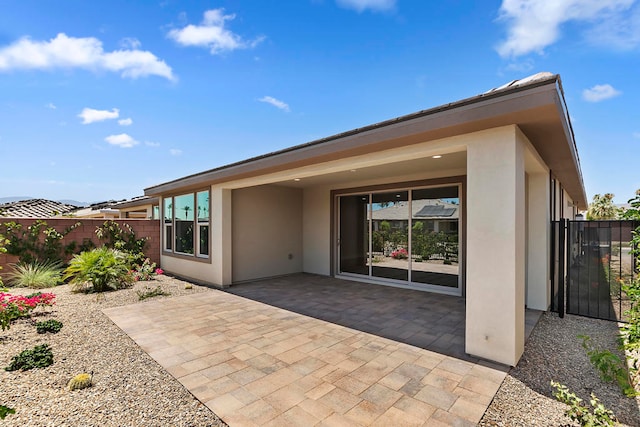 rear view of house featuring a patio