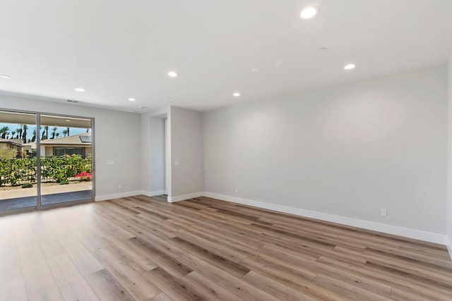 spare room with light hardwood / wood-style floors