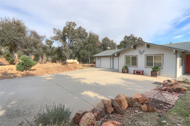 view of property exterior with a garage