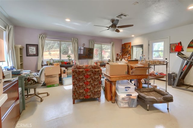 miscellaneous room with ceiling fan and a healthy amount of sunlight