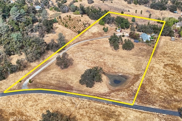 birds eye view of property with a rural view