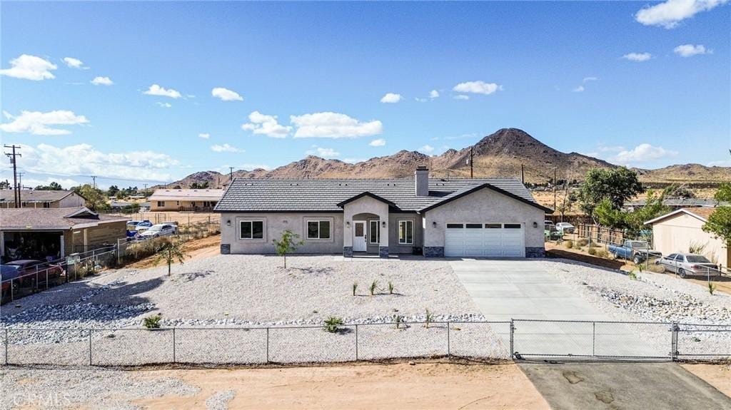 view of front of house featuring a mountain view and a garage