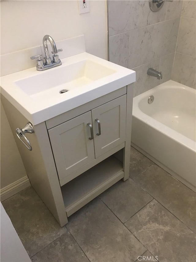 bathroom featuring vanity and tiled shower / bath combo