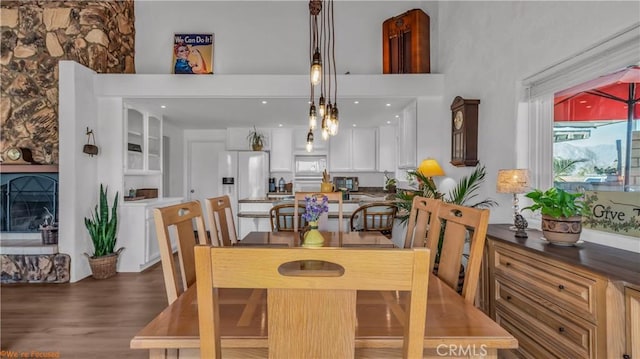 dining space with dark wood-style flooring