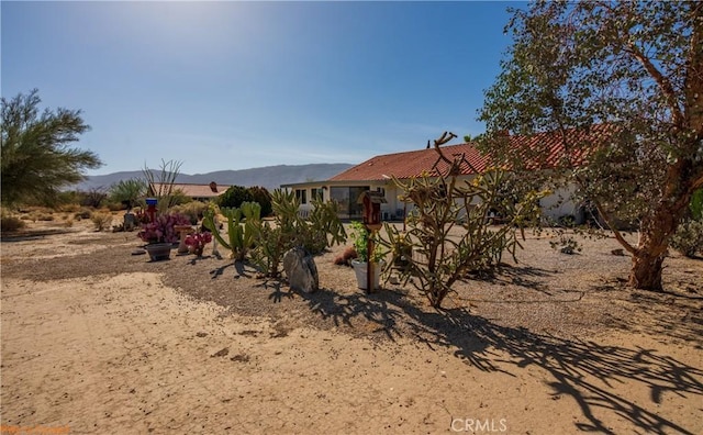 exterior space featuring a mountain view