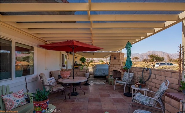 view of patio with a grill and a mountain view