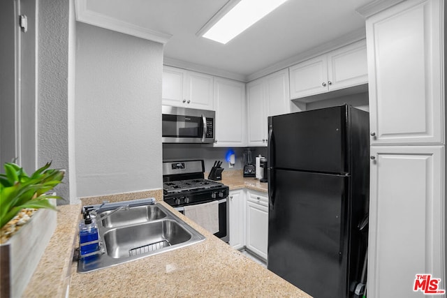 kitchen featuring white cabinets, sink, and appliances with stainless steel finishes