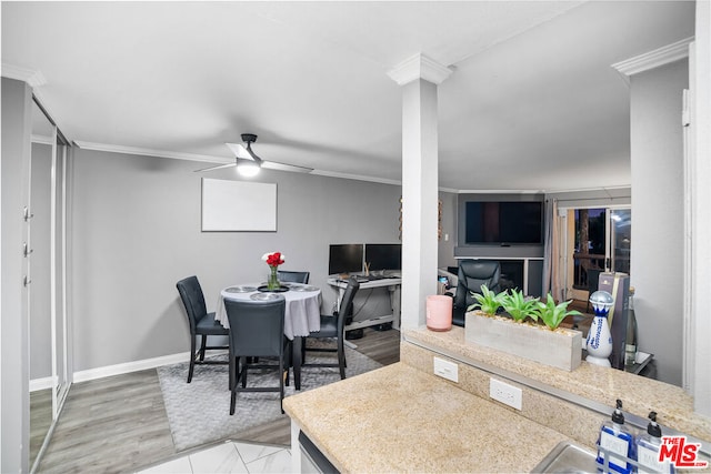 dining area with hardwood / wood-style flooring, ceiling fan, and ornamental molding