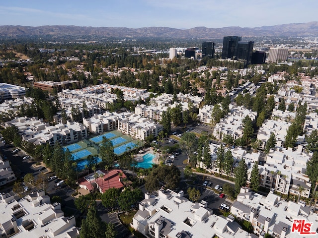 birds eye view of property with a mountain view