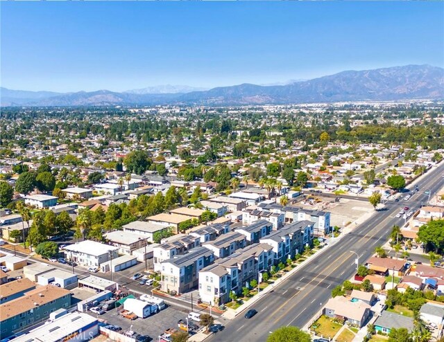 birds eye view of property with a mountain view