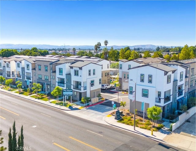 birds eye view of property featuring a mountain view