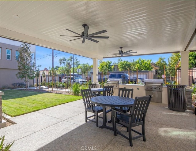 view of patio featuring area for grilling and ceiling fan