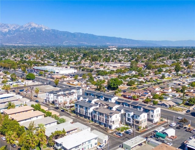 birds eye view of property featuring a mountain view