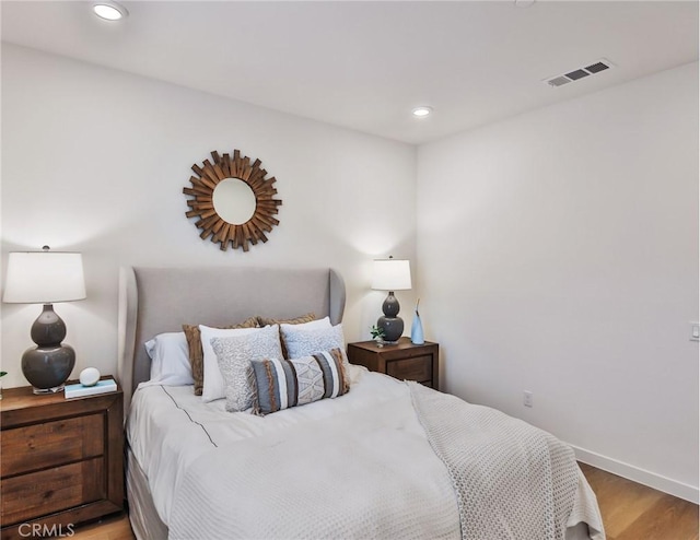 bedroom with light wood-type flooring