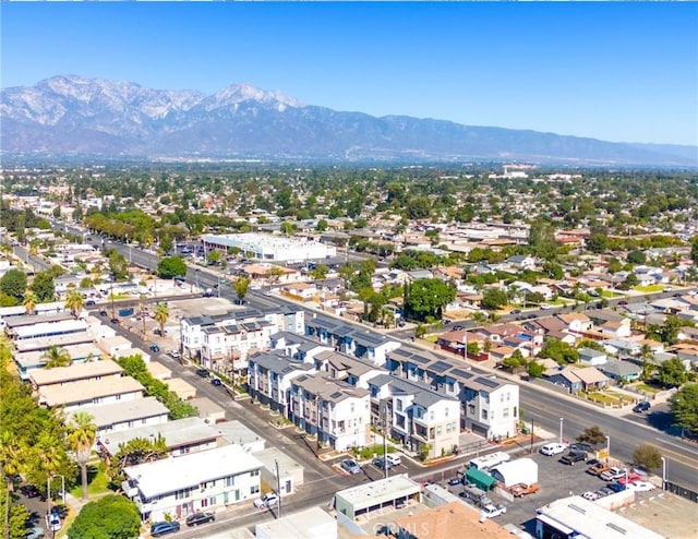 birds eye view of property featuring a mountain view