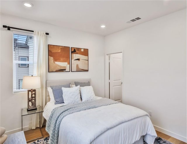 bedroom featuring hardwood / wood-style floors