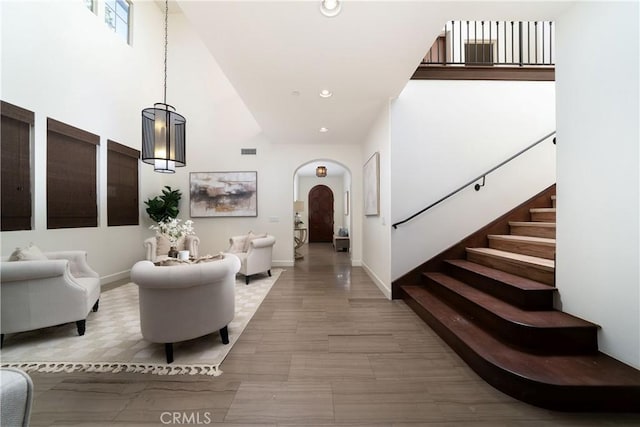 102 Catalonia, Irvine, CA 92618 - foyer entrance with recessed lighting, a towering ceiling, visible vents, arched walkways, and stairs