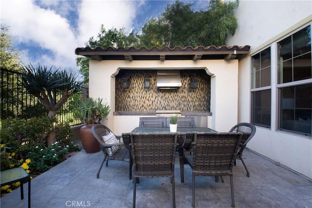 102 Catalonia, Irvine, CA 92618 - view of patio / terrace featuring outdoor dining area and fence
